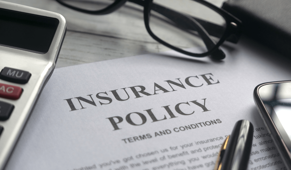 Homeowner reviewing roof insurance policy documents in Colorado