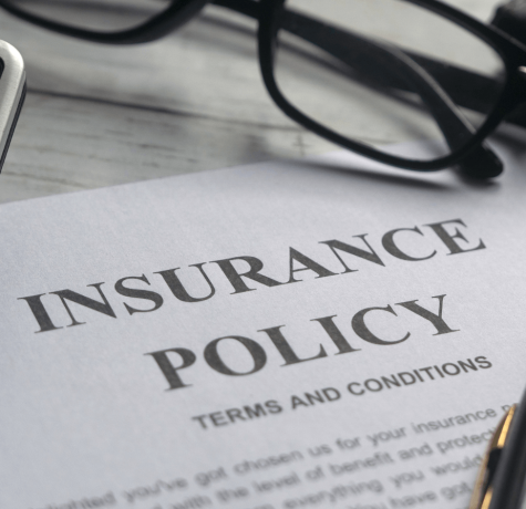 Homeowner reviewing roof insurance policy documents in Colorado