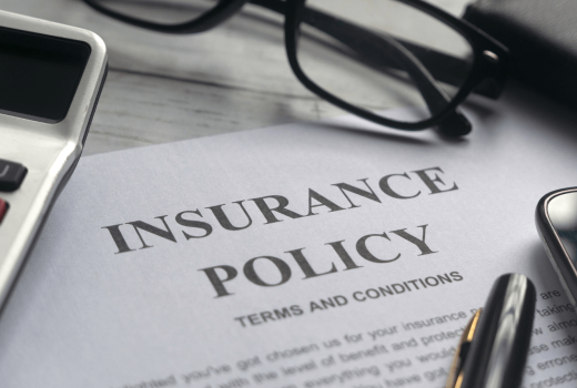 Homeowner reviewing roof insurance policy documents in Colorado