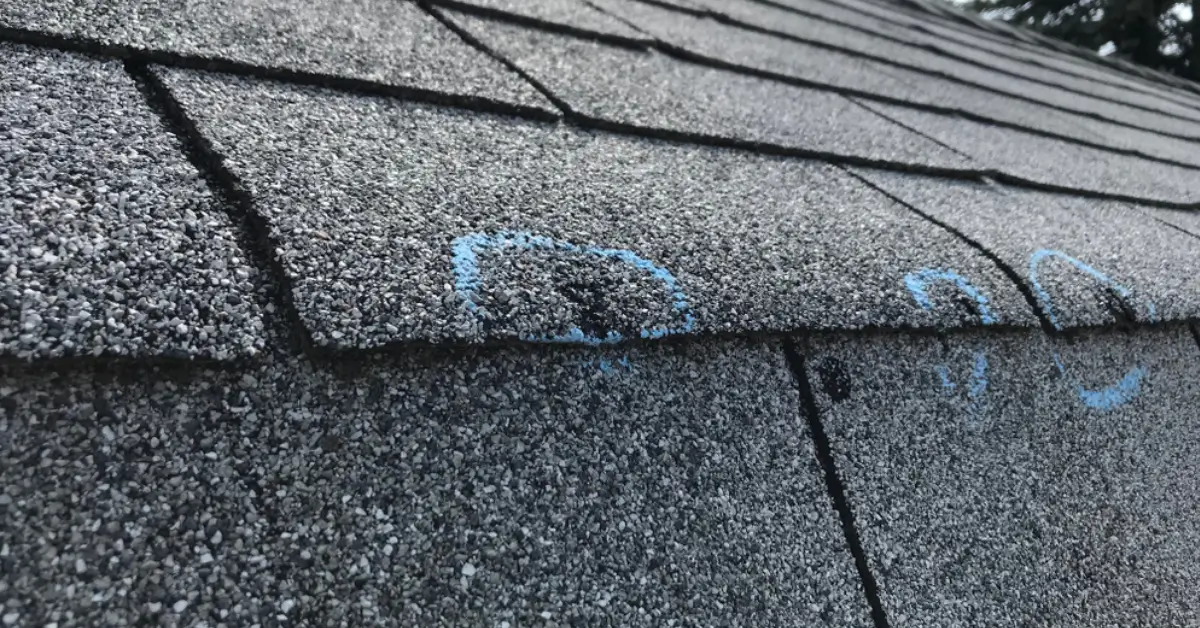 Roof damage that has been reported to insurance for a replacement claim.