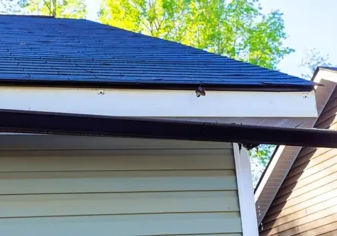 new gutter system installation improving water drainage