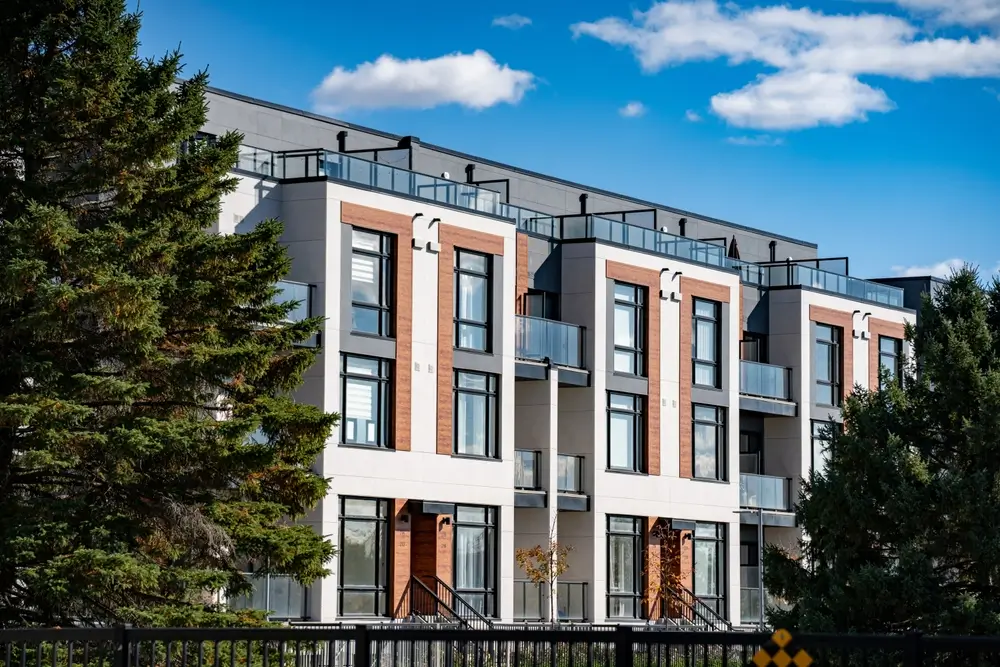 Multifamily roofing contractor working on condominium roofing system in the Denver metro area