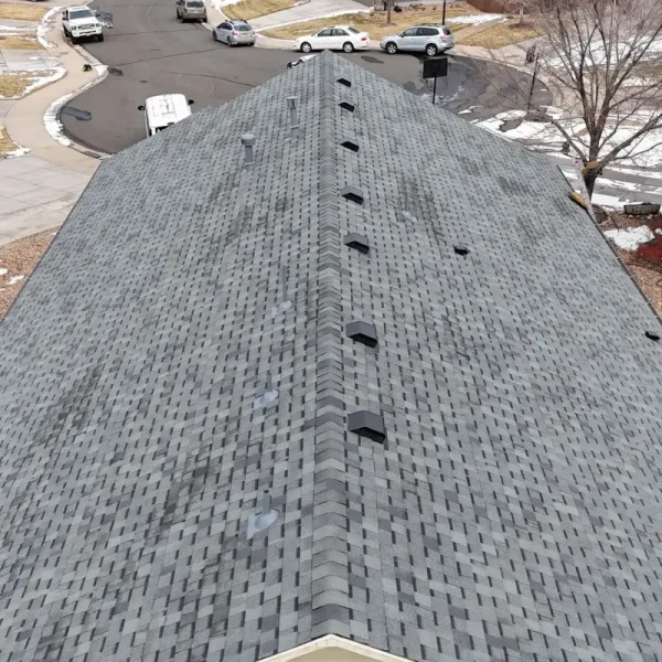 Aerial view of completed asphalt shingle roof replacement on Castle Rock home