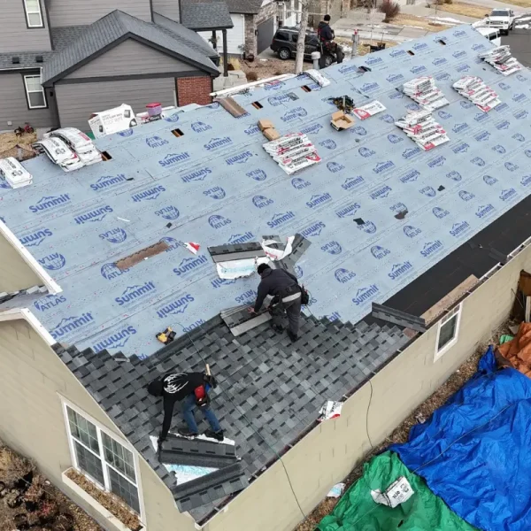 Roofers installing asphalt shingles over Atlas Summit synthetic underlayment