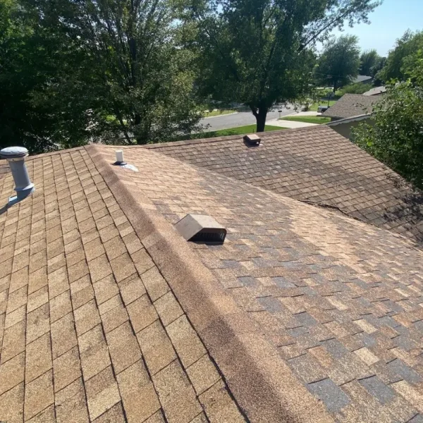 Existing residential roof in McPherson, KS before replacement following hail and wind storm damage.