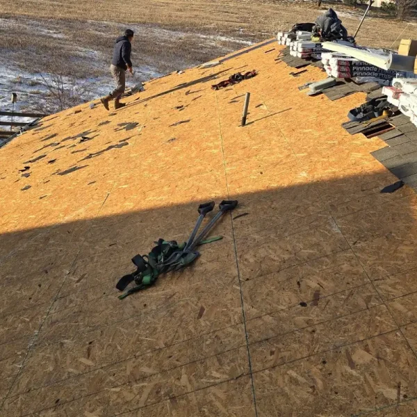 Roofing crew removing old shingles during Castle Rock roof replacement
